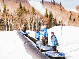 Glissade sur tube au Parc régional de Val-d'Irène